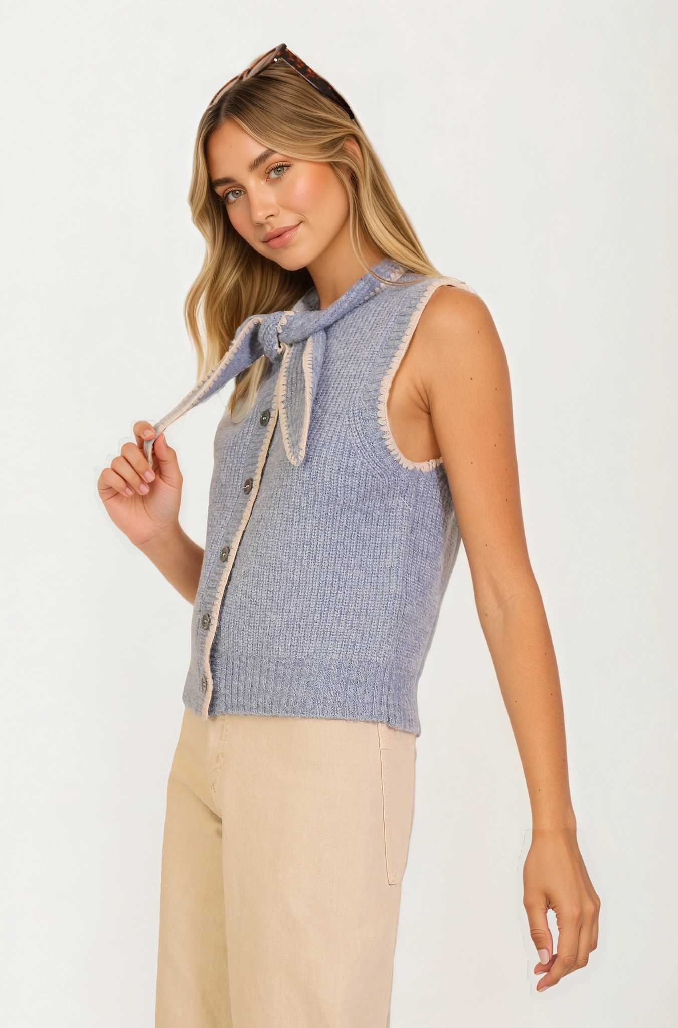 Sleeveless Knit Vest with Contrast Trim and Bow Detail