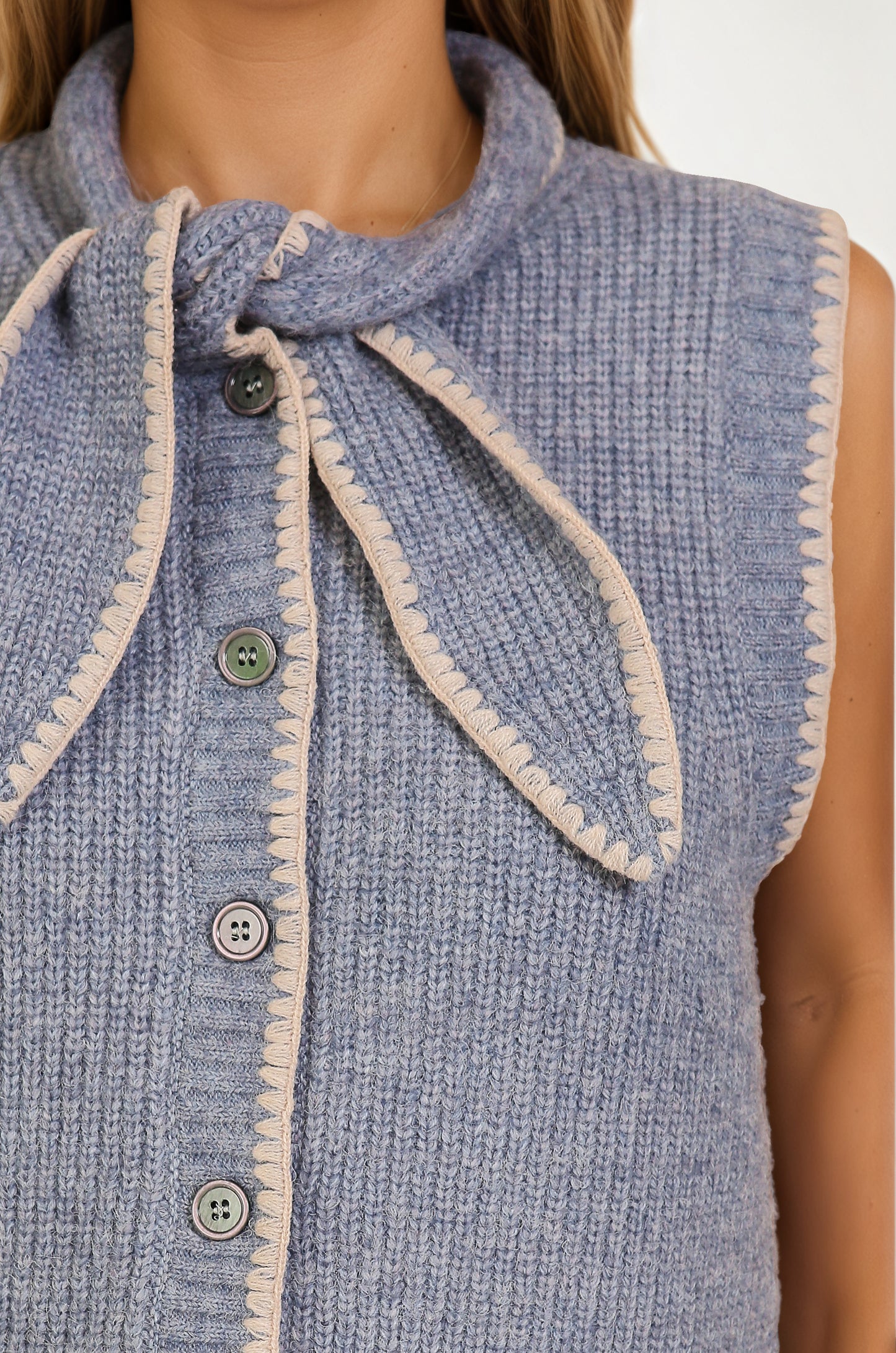Sleeveless Knit Vest with Contrast Trim and Bow Detail