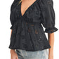 Black Eyelet Peplum Top with Deep V-Neckline