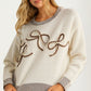 Knit Sweater with Textured Bow Embroidery and Striped Trim