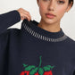 Playful Strawberry Knit Sweater with Ribbed Hem and Long Sleeves