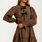 Plaid Mini Dress with Bow Accents and Long Puff Sleeves