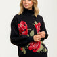 Black Turtleneck Sweater with Bold Red Rose Design