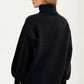 Black Turtleneck Sweater with Bold Red Rose Design