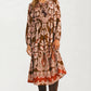 Long Sleeve Midi Dress with Tie Neck and Flowing Silhouette