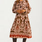 Long Sleeve Midi Dress with Tie Neck and Flowing Silhouette