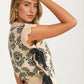 Floral Knit Sweater Vest With Side Ties And Scalloped Hems