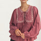 Flowy Long Sleeve Blouse with Embroidered Yoke and Tie Neckline