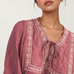 Flowy Long Sleeve Blouse with Embroidered Yoke and Tie Neckline