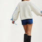 Ivory Crochet Sweater with Blue Ribbon Tie Sleeve Details