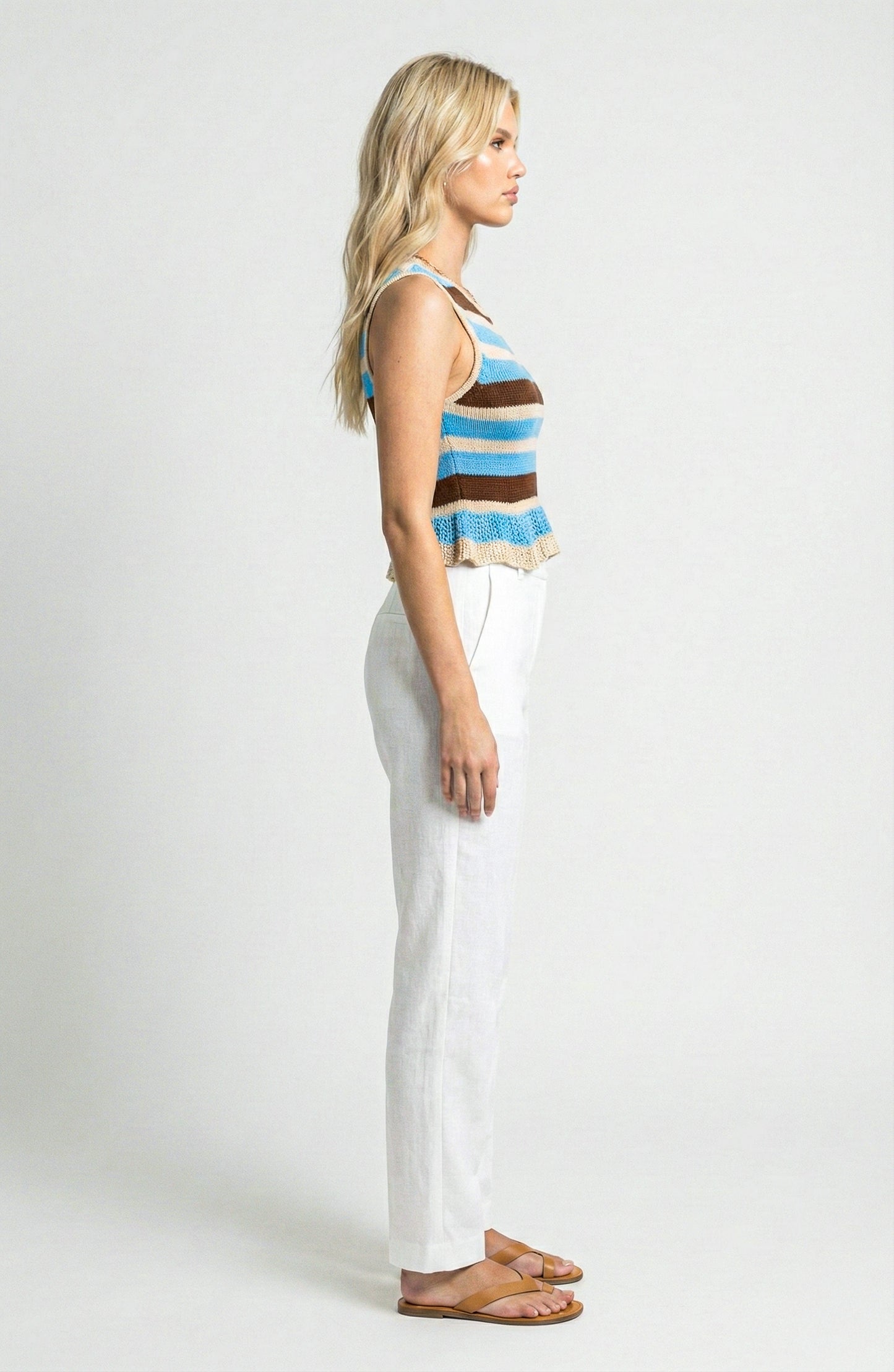 Sleeveless Knit Top with Stripe Pattern and Ruffle Hem